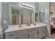 Beautiful bathroom with double sinks, a large mirror, and lots of cabinet space at 4617 W Cottontail Rd, Phoenix, AZ 85086