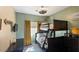 bedroom with bunk beds, modern ceiling fan, and wall-mounted television at 4617 W Cottontail Rd, Phoenix, AZ 85086