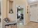 Inviting entryway featuring tiled floors, a bench seat with storage, and an office view at 4617 W Cottontail Rd, Phoenix, AZ 85086