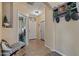 Cozy entryway featuring a bench, decorative shelf, and tiled floor at 4617 W Cottontail Rd, Phoenix, AZ 85086