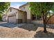 Inviting single-Gathering home featuring a two-car garage and desert landscaping at 4617 W Cottontail Rd, Phoenix, AZ 85086
