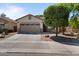 Attractive home with desert landscaping, a paved driveway, and a two-car garage at 4617 W Cottontail Rd, Phoenix, AZ 85086
