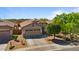 Inviting home with desert landscaping, a well-kept lawn, and a welcoming front entrance at 4617 W Cottontail Rd, Phoenix, AZ 85086