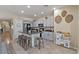 Spacious kitchen featuring an island with barstools, stainless appliances, and ample counter space for cooking at 4617 W Cottontail Rd, Phoenix, AZ 85086