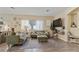Stylish living room with wood floors, comfortable seating, and a wall-mounted TV at 4617 W Cottontail Rd, Phoenix, AZ 85086
