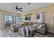 Comfortable living room with an oversized couch, ceiling fan and a large rug, perfect for relaxing at 4617 W Cottontail Rd, Phoenix, AZ 85086