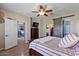 Main bedroom boasts a walk-in closet, a TV, and an ensuite bathroom at 4617 W Cottontail Rd, Phoenix, AZ 85086