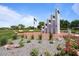 View of a park featuring an American flag and war memorial monument surrounded by manicured lawns and landscaping at 4617 W Cottontail Rd, Phoenix, AZ 85086