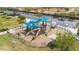 Fun playground area with colorful shades, play structures, and swings, all surrounded by grassy lawns at 4617 W Cottontail Rd, Phoenix, AZ 85086