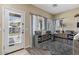 Bright playroom with large windows, cubbies for storage, and a door leading to the backyard at 4617 W Cottontail Rd, Phoenix, AZ 85086
