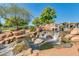 Serene water feature with cascading waterfalls and lush greenery creating a peaceful ambiance at 4617 W Cottontail Rd, Phoenix, AZ 85086