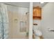 Bathroom features a tiled shower and wood cabinets at 4618 E Valley View Dr, Phoenix, AZ 85044