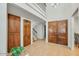 Home foyer with grand, high ceiling and wooden accents at 4618 E Valley View Dr, Phoenix, AZ 85044