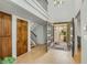 Light-filled foyer with double doors and views to front entrance at 4618 E Valley View Dr, Phoenix, AZ 85044