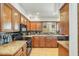 Modern kitchen featuring granite countertops and sleek black appliances at 4618 E Valley View Dr, Phoenix, AZ 85044