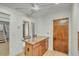 Bright, eat-in kitchen area boasts a ceiling fan, windows, and an island with seating at 4618 E Valley View Dr, Phoenix, AZ 85044