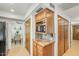 The kitchen features wood cabinets and granite countertops and a dining area visible through doorway at 4618 E Valley View Dr, Phoenix, AZ 85044