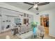 Open-concept living and dining area with wood floors and bright natural light at 4618 E Valley View Dr, Phoenix, AZ 85044