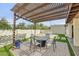 Cozy outdoor patio area, complete with a dining table and lush landscaping at 4618 E Valley View Dr, Phoenix, AZ 85044