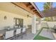 Spacious patio area featuring a pergola, built-in grill, and comfortable seating for outdoor dining at 4618 E Valley View Dr, Phoenix, AZ 85044