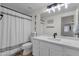 This bathroom has a white sink and mirror and a shower at 4633 E Desert Cactus St, Phoenix, AZ 85032