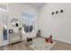 Bright bedroom with large windows, light wood flooring, and neutral paint at 4633 E Desert Cactus St, Phoenix, AZ 85032