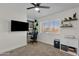 Bedroom includes a ceiling fan and a window with blinds and shelf space at 4633 E Desert Cactus St, Phoenix, AZ 85032