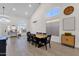 Bright dining room featuring a large table, high ceilings, and ample natural light at 4633 E Desert Cactus St, Phoenix, AZ 85032