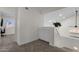 Upstairs hallway featuring custom cabinet, natural light, and carpet flooring at 4633 E Desert Cactus St, Phoenix, AZ 85032