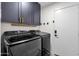 The laundry room features front loading appliances at 4633 E Desert Cactus St, Phoenix, AZ 85032
