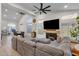 Spacious living room showcasing a fireplace, sectional sofa, and dining area at 4633 E Desert Cactus St, Phoenix, AZ 85032