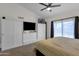 Spacious main bedroom featuring custom closet, ceiling fan and natural lighting at 4633 E Desert Cactus St, Phoenix, AZ 85032