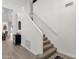 Carpeted staircase with white walls and a modern cabinet at 4633 E Desert Cactus St, Phoenix, AZ 85032
