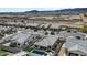 An aerial shot showcases modern single-Gathering homes with pools, desert landscaping, and scenic mountain views at 5951 N 190Th Dr, Litchfield Park, AZ 85340