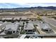 This aerial showcases beautiful desert landscaping, neighborhood parks and amenities, and nearby mountains at 5951 N 190Th Dr, Litchfield Park, AZ 85340