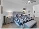 Spacious bedroom featuring a ceiling fan, patterned bedding, and comfortable layout promoting relaxation at 5951 N 190Th Dr, Litchfield Park, AZ 85340