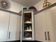 Kitchen cabinet with convenient pull-out shelves for easy access and organized storage of kitchen essentials at 5951 N 190Th Dr, Litchfield Park, AZ 85340