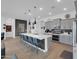 Modern kitchen with stainless steel appliances, white countertops, and seating perfect for entertaining and cooking at 5951 N 190Th Dr, Litchfield Park, AZ 85340