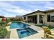 Gorgeous pool and spa with lush landscaping, perfect for relaxing at 5951 N 190Th Dr, Litchfield Park, AZ 85340