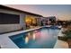 Backyard with sparkling pool, covered patio, and outdoor BBQ area, great for entertaining at 5951 N 190Th Dr, Litchfield Park, AZ 85340