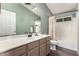 Bathroom features a large vanity, modern fixtures, and shower/tub combo at 632 W Natal Cir, Mesa, AZ 85210