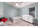Bright bedroom features a ceiling fan, a window, fluffy rug, and white dresser at 632 W Natal Cir, Mesa, AZ 85210