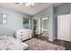 Bright bedroom features a ceiling fan, a window, fluffy rug, and sliding mirrored closet at 632 W Natal Cir, Mesa, AZ 85210