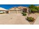 Inviting single Gathering home with a three car garage and low maintenance desert landscaping at 632 W Natal Cir, Mesa, AZ 85210