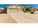 Inviting single Gathering home with a three car garage and desert landscaping at 632 W Natal Cir, Mesa, AZ 85210