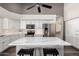 Bright open kitchen with a large island, stainless steel appliances, and sleek white cabinetry at 632 W Natal Cir, Mesa, AZ 85210