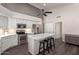 Bright open kitchen with a large island, stainless steel appliances, and sleek white cabinetry at 632 W Natal Cir, Mesa, AZ 85210