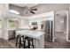 Bright open kitchen with a large island, stainless steel appliances, and sleek white cabinetry at 632 W Natal Cir, Mesa, AZ 85210