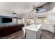 Open-concept living room with views into the kitchen, and a backyard pool view at 632 W Natal Cir, Mesa, AZ 85210