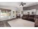 Open-concept living room with seamless flow to the dining area, showcasing an inviting and modern space at 632 W Natal Cir, Mesa, AZ 85210